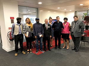 Shai Reshef poses with UoPeople students in Birmingham, England in July 2018.