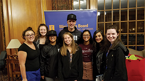 TWLOHA founder Jamie Tworkowski poses with students after a speaking event.
