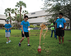 Students have fun with an experiment at the University of South Florida St. Petersburg STEM Robotics Summer Camp