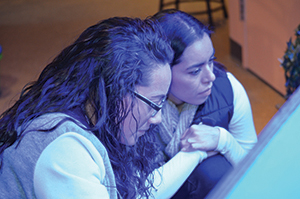 Members of East Stroudsburg University’s Clear Path program take their studies outside of the classroom at the DaVinci Science Center in Allentown, Pennsylvania. Pictured here, Clear Path Scholar and mathematics major Erica Ward and one of her guests enjoy an exhibit.