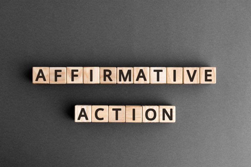 Photo of wooden letter tiles arranged to spell out "affirmative action."
