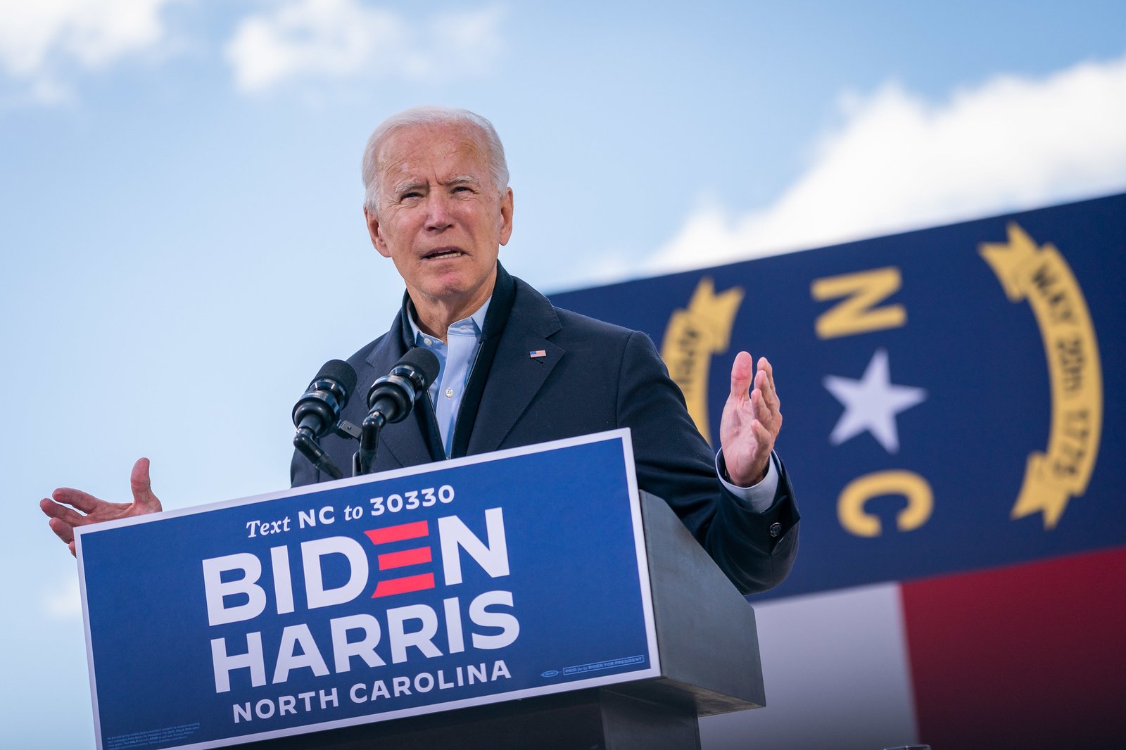Photo of President-elect Joe Biden standing at a podium at a campaign rally
