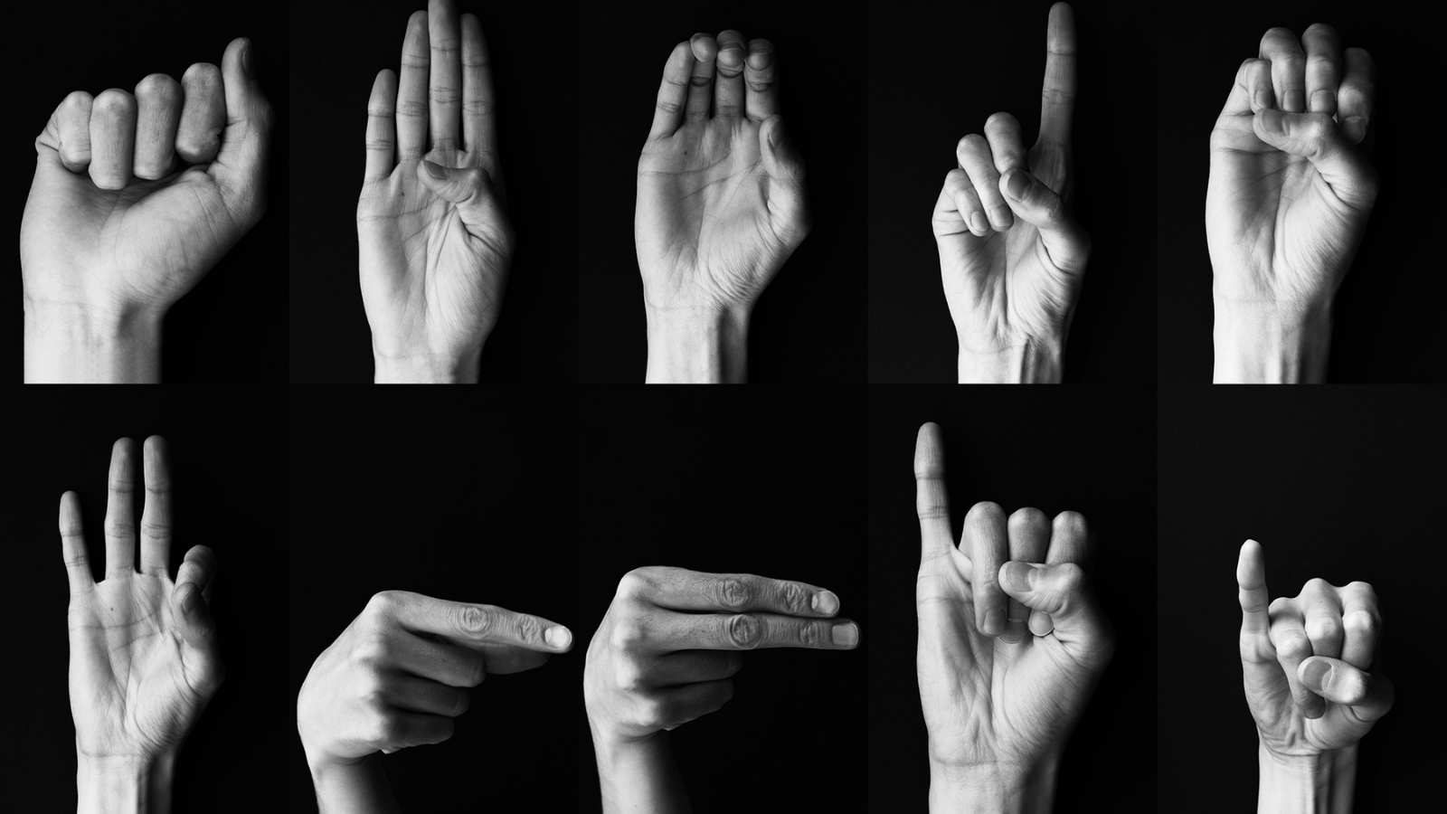 Black and white photos of hands making the signs of the American Sign Language alphabet