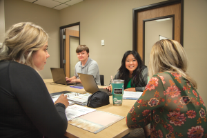 Students discuss class work at Lake Area Technical College. The institution experienced a 3 percent increase in its freshman class and cites job placement as one reason for the growth.