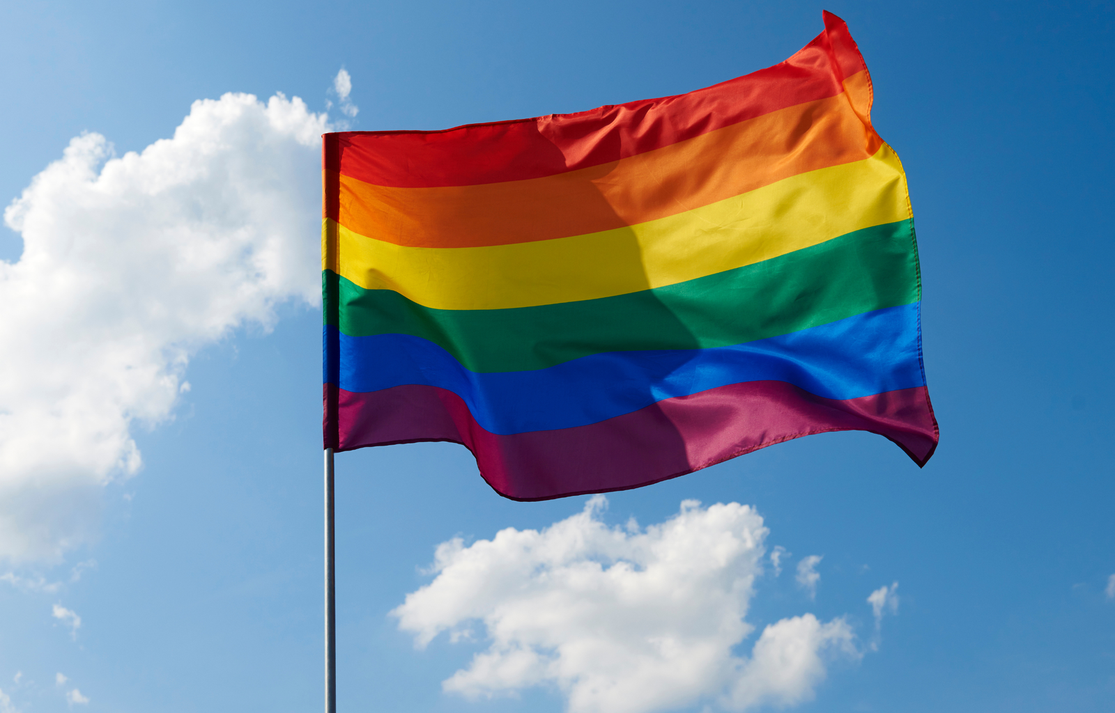 LGBTQ flag waving in the sky