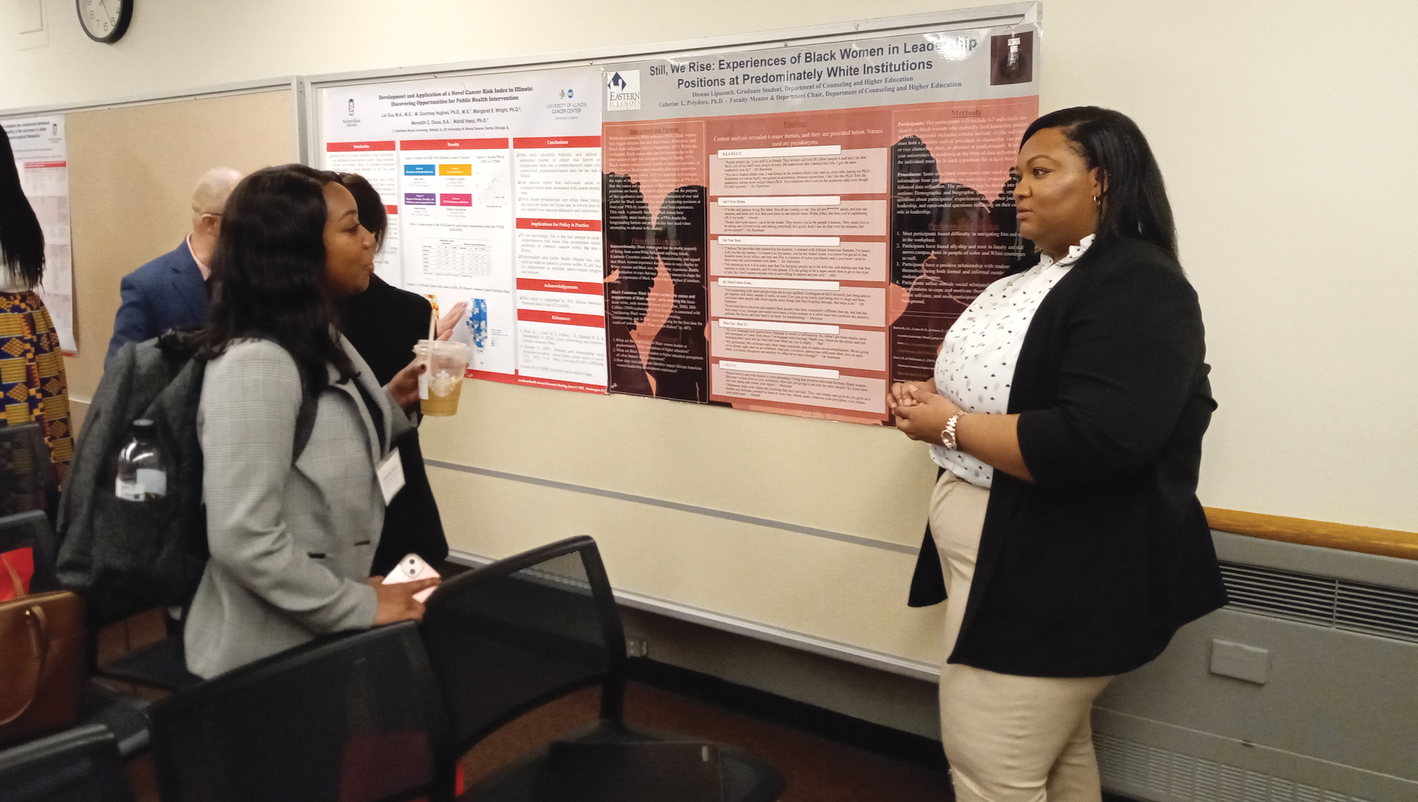 Two graduate students talk at the Preparing Future Faculty of Color Conference.