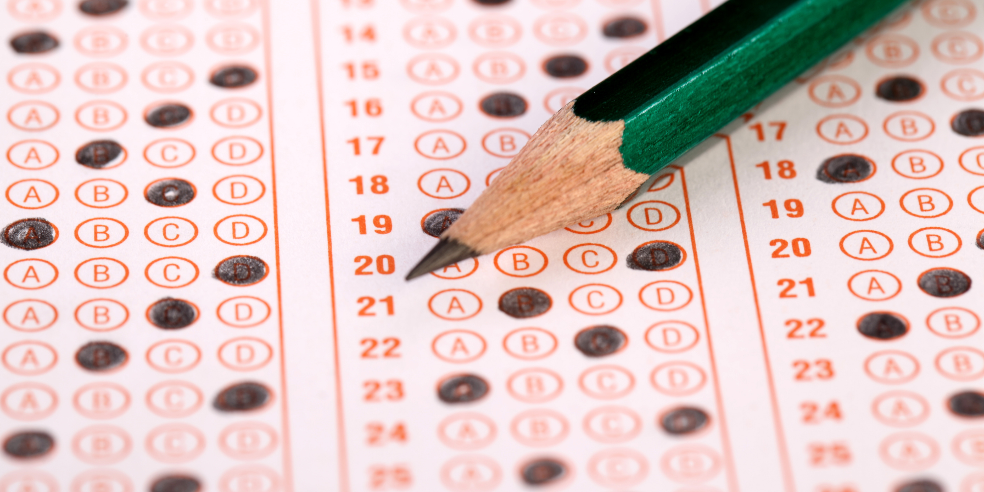 Pencil lying on top of test bubble sheet