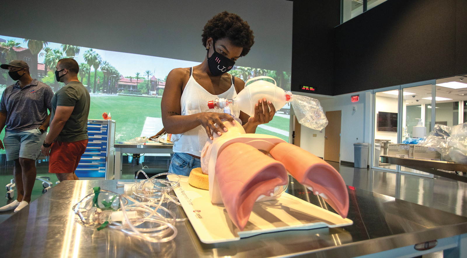 A student-veteran and member of WSP learns how to administer first aid using a model. (Photo courtesy of WSP)