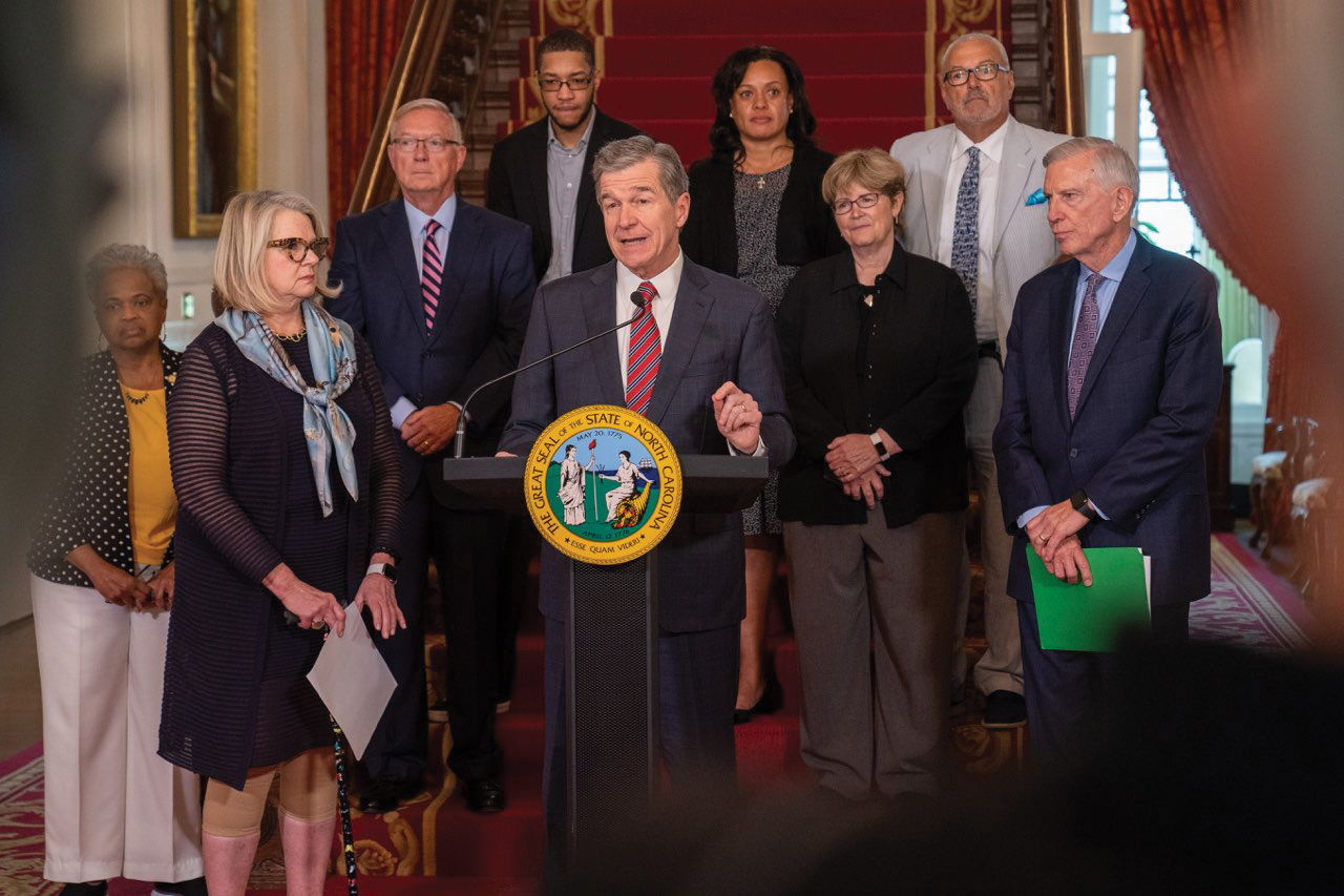 North Carolina Gov. Roy Cooper’s (center) bipartisan Commission on Public University Governance has recommended numerous changes to the state’s university governance structure to improve diversity and transparency among higher education leadership.