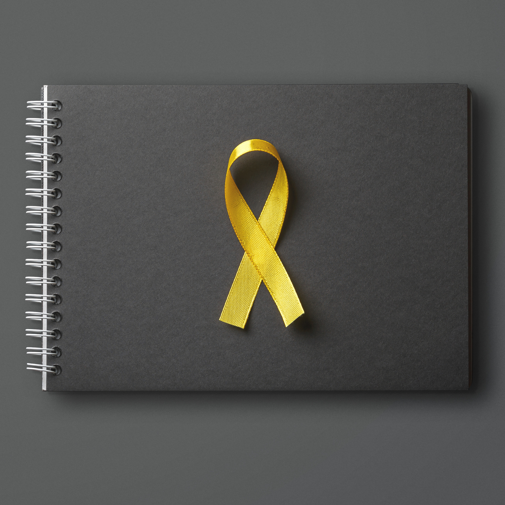 Yellow ribbon on black background